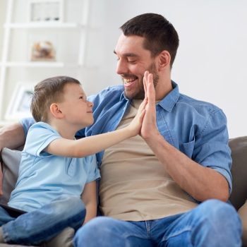Help Your Child Achieve Success! *Father and son giving each other five in celebration*